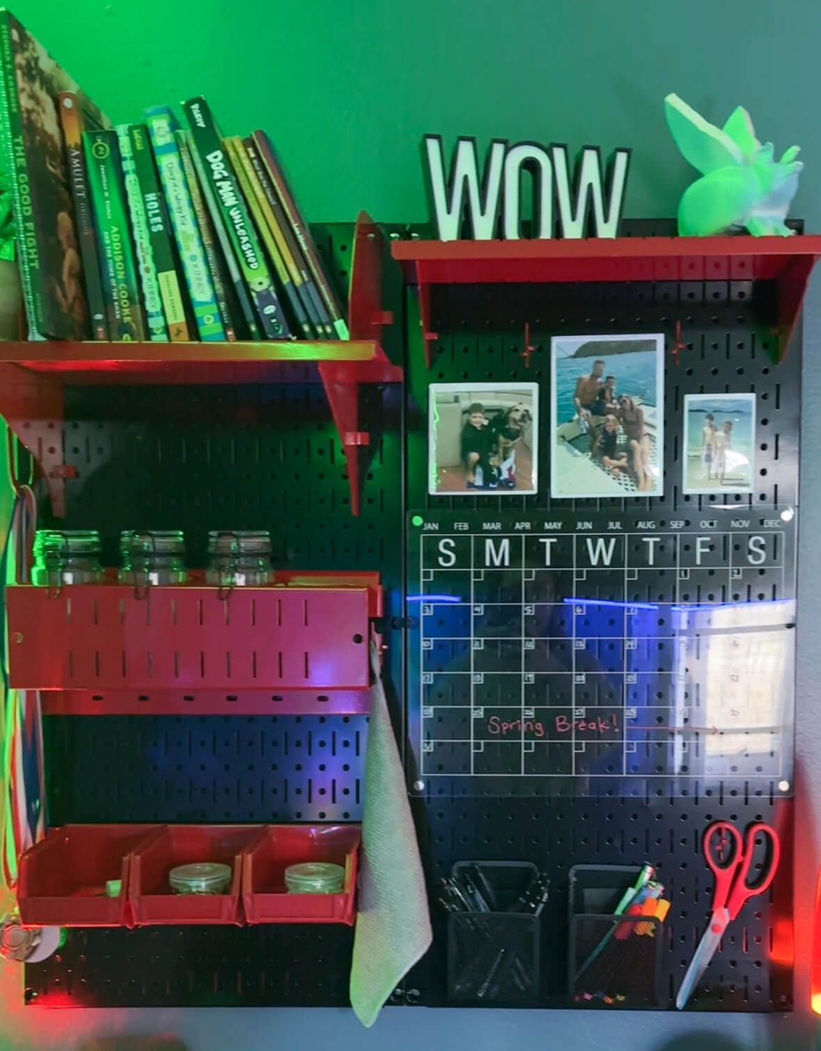 Colored lighting shining on a work board over a desk.