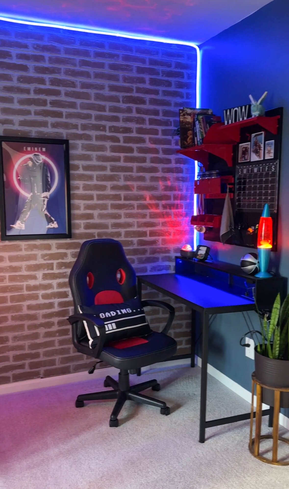 Reveal of the final look of the a bedroom makeover with gaming chair, pillow, desk, wall calendar, lava lamp, and Eminem poster.