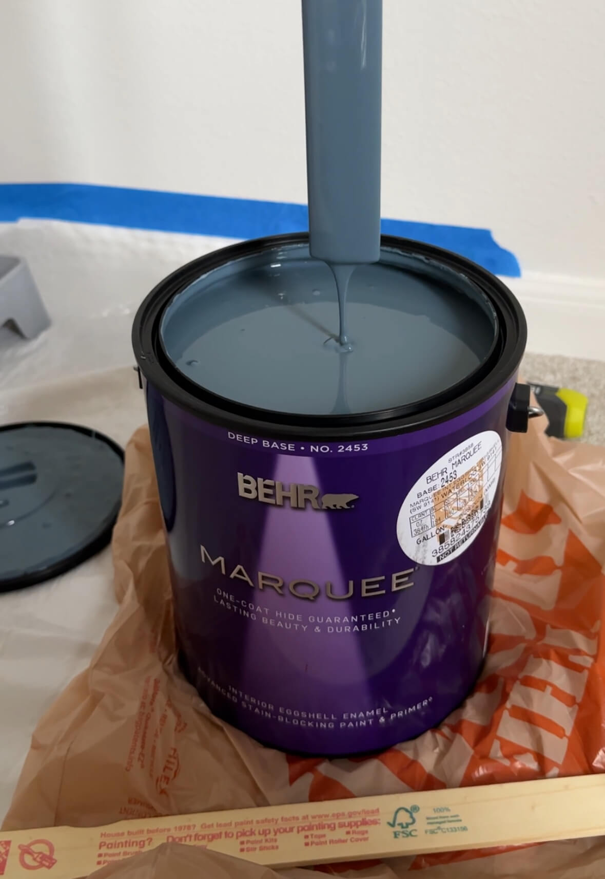 Dark blue-gray paint in a Behr Marquee paint can.