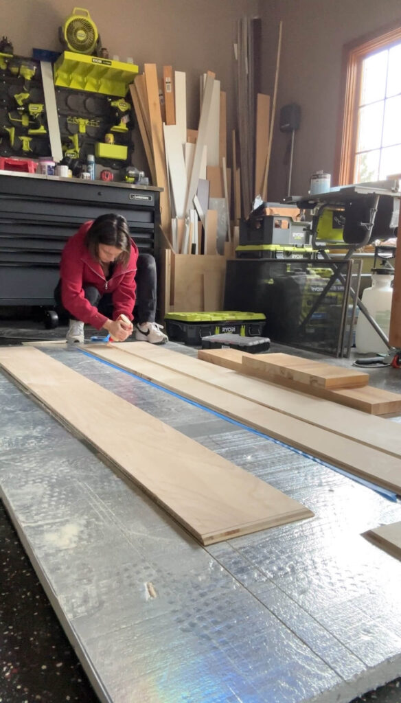 Melissa Tyler preparing her wood for a DIY fireplace mantel.