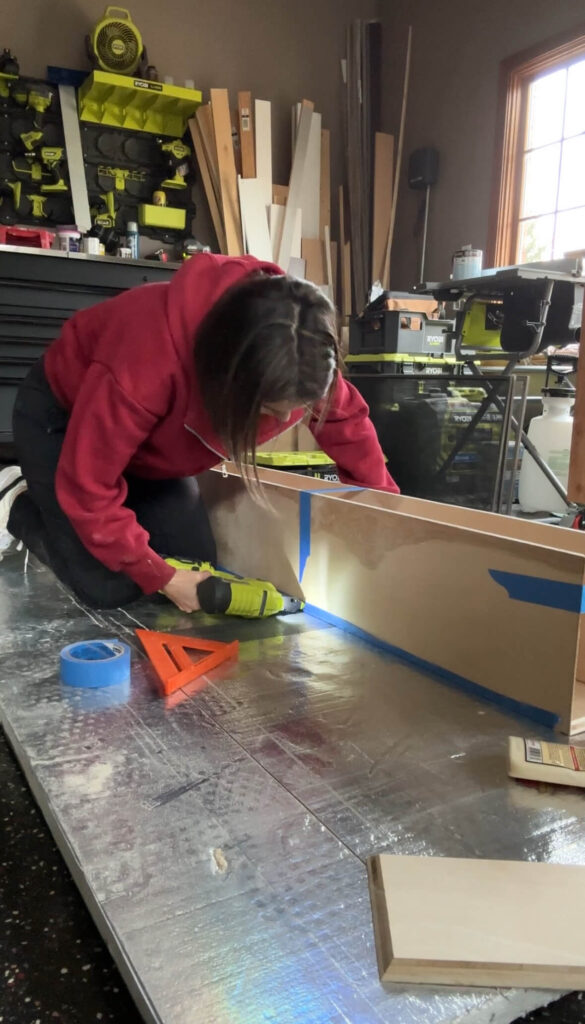 Melissa Tyler assembling the DIY mantle.