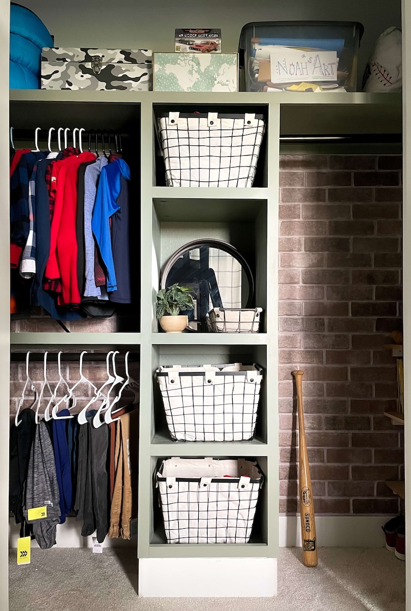 DIY closet tower and shelves installed in front of a faux brick wall.