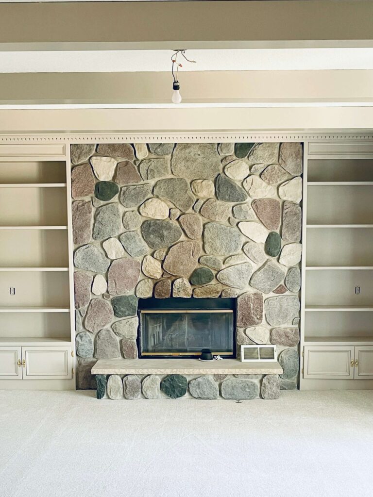 Original stone fireplace before the over grouting DIY project. 