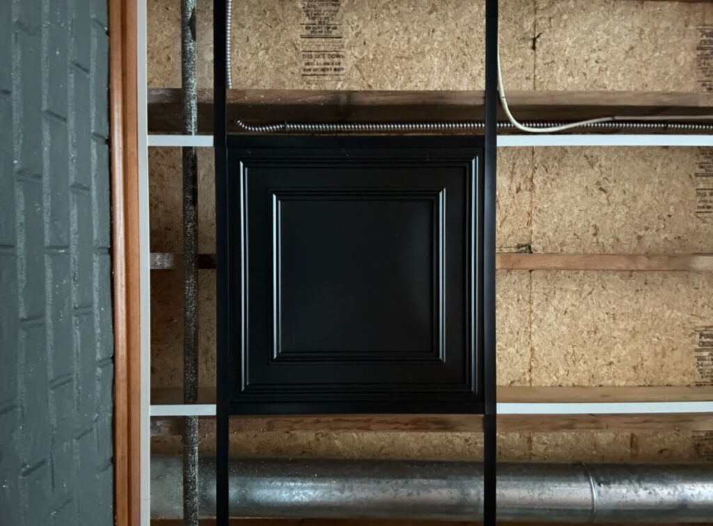 Close up of black tile used for ceiling project.